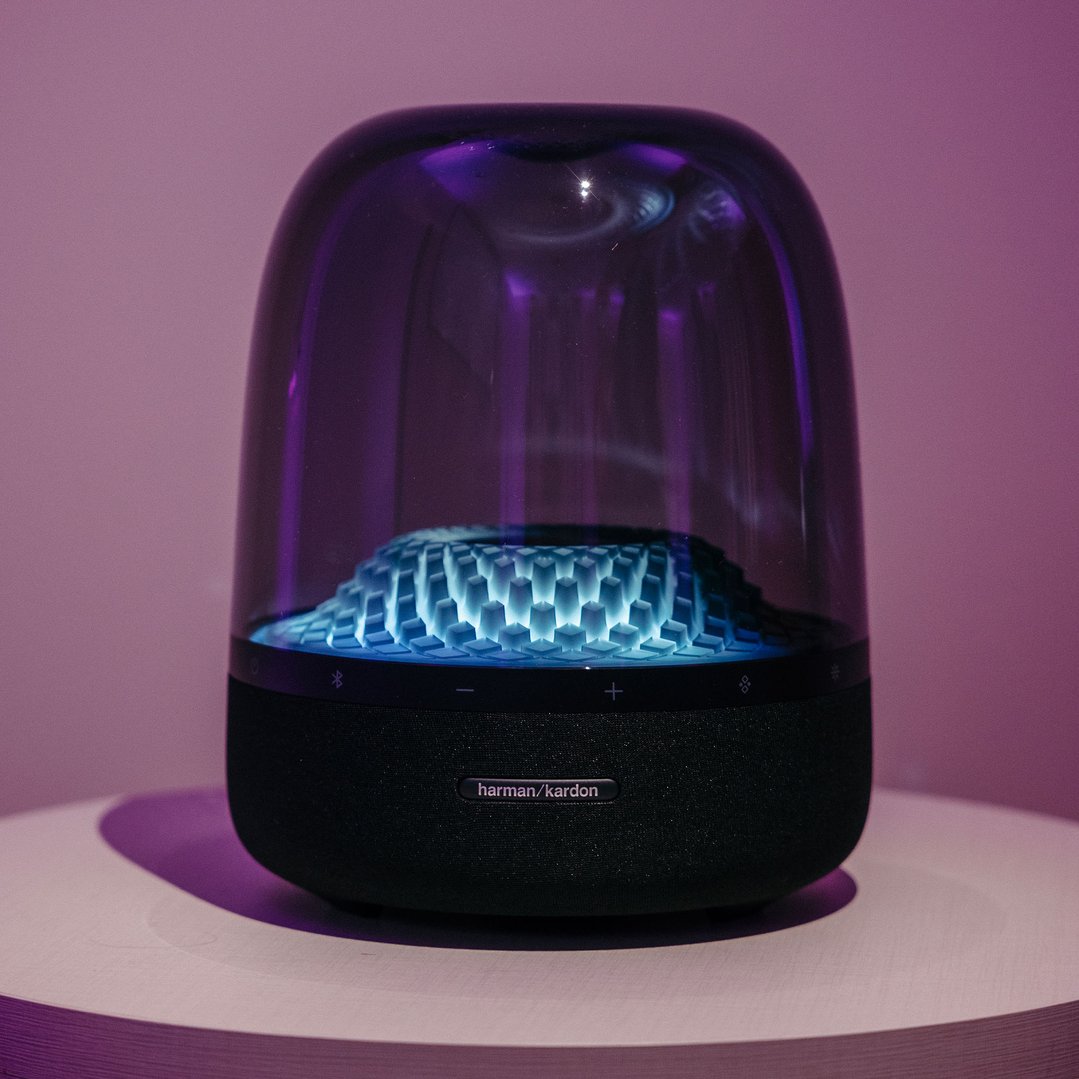 Harman Kardon Aura Studio 4 Wireless Bluetooth Speaker on a white surface