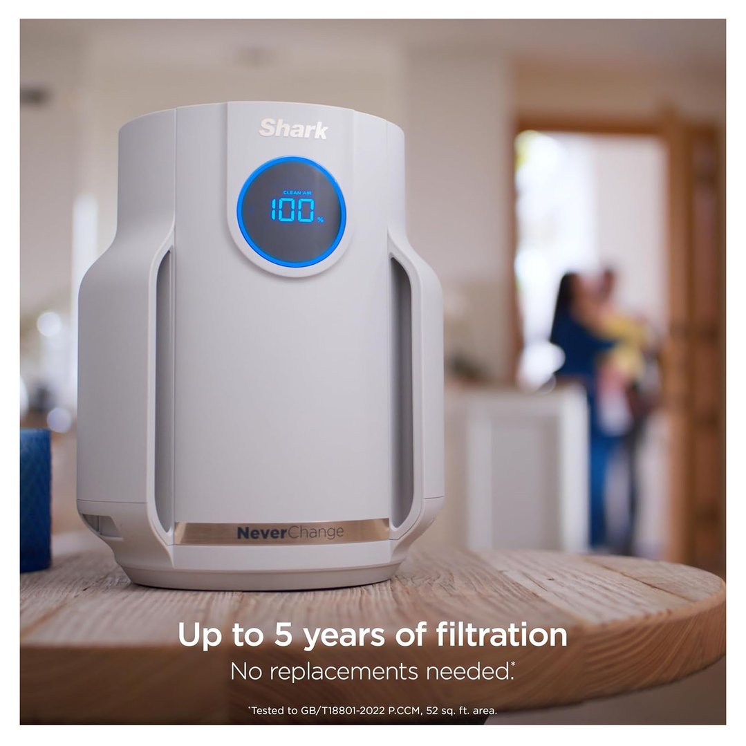 Shark NeverChange air purifier on a wooden table in a home setting