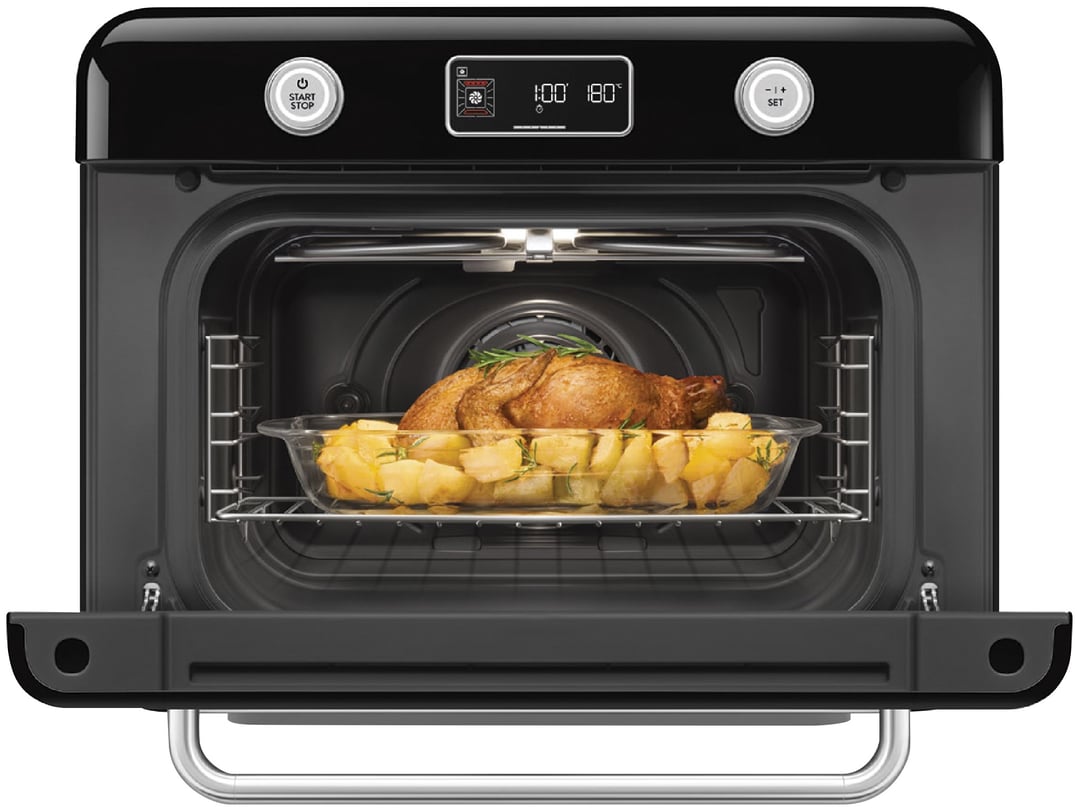 Black SMEG Benchtop Combi-Steam Oven with roasted chicken and potatoes inside