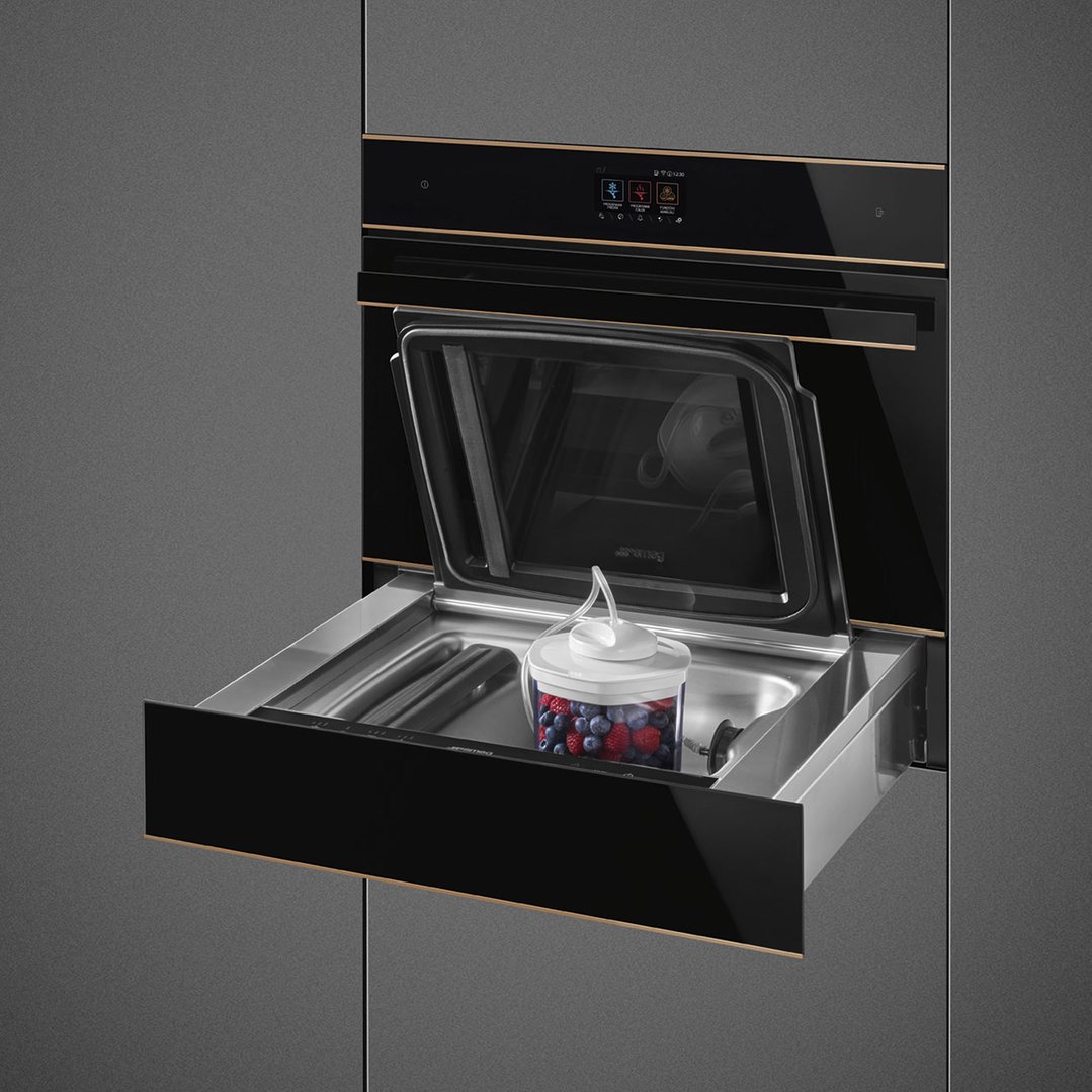 Built-in blast chiller with an open drawer containing a container of berries