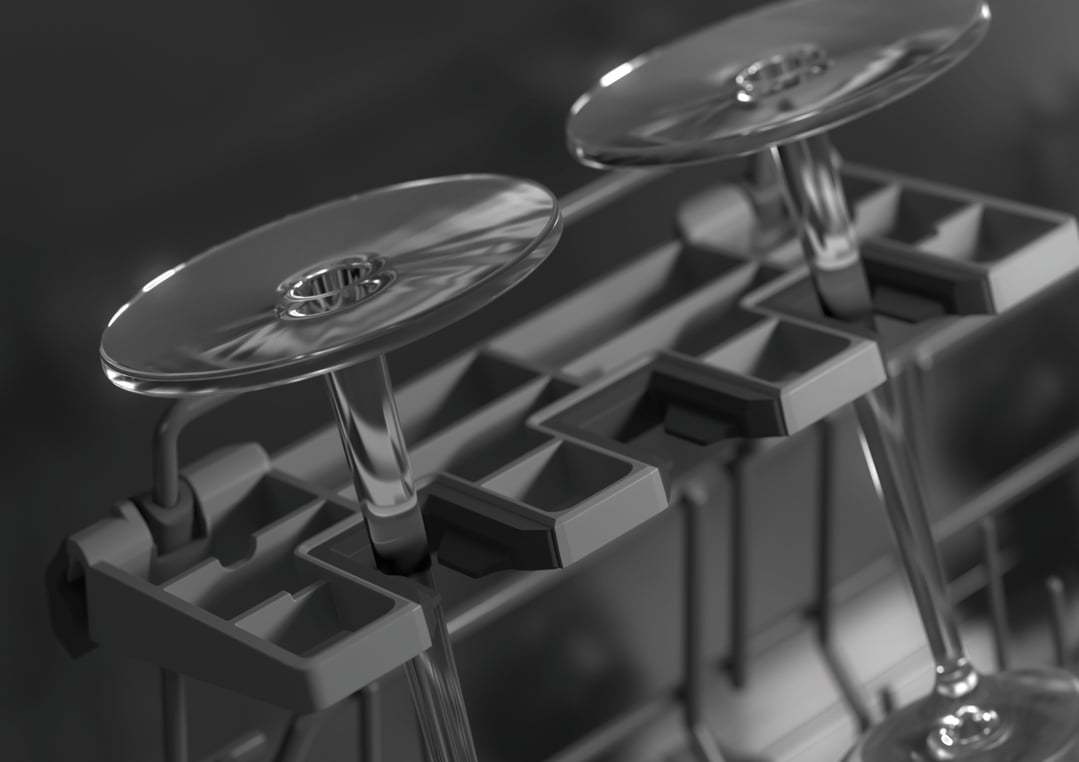 Close up of wine glasses in the dishwasher rack