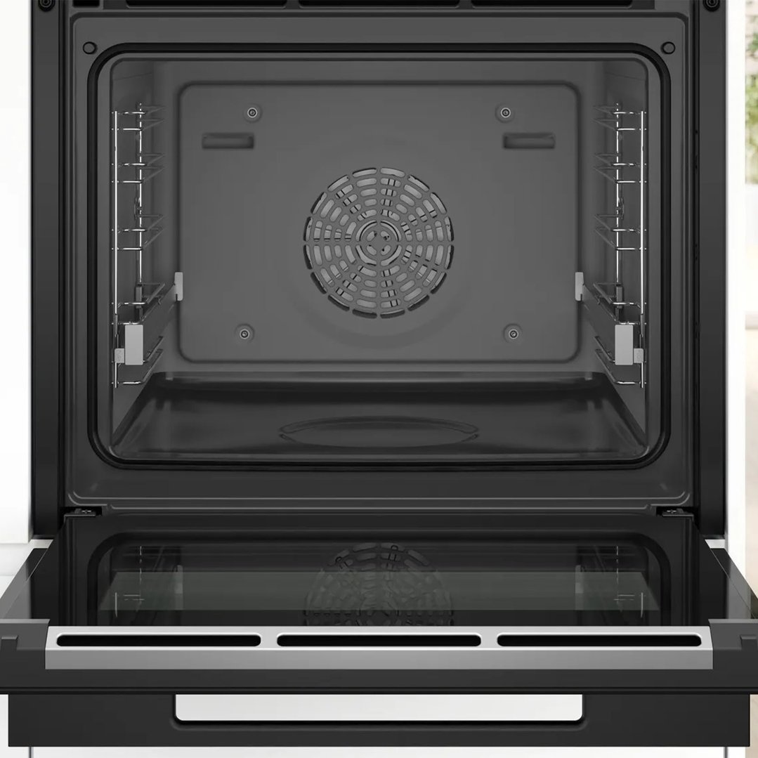 Open built-in oven with steam function showing interior racks and fan