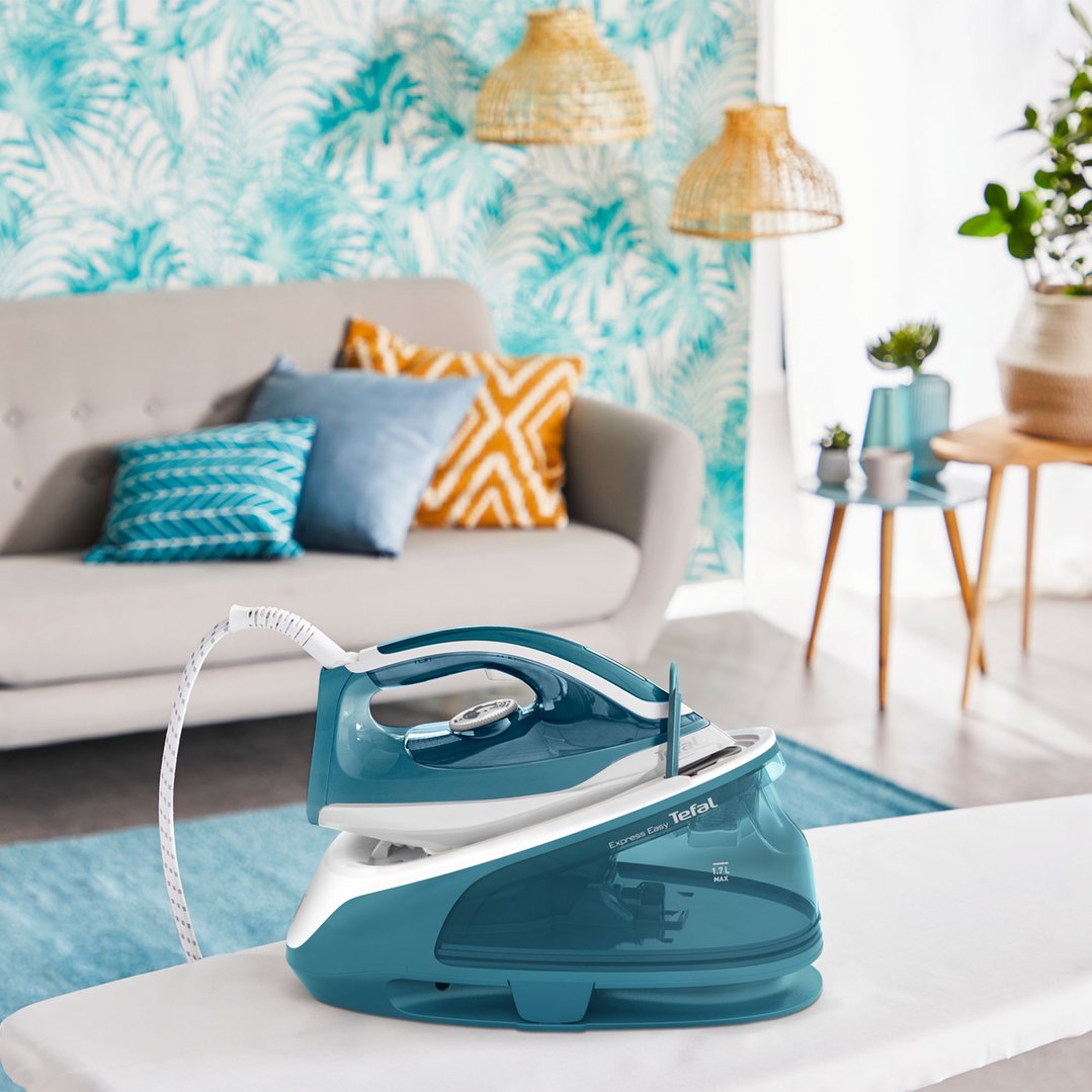 Tefal Express Easy Steam Generator iron on an ironing board in a living room