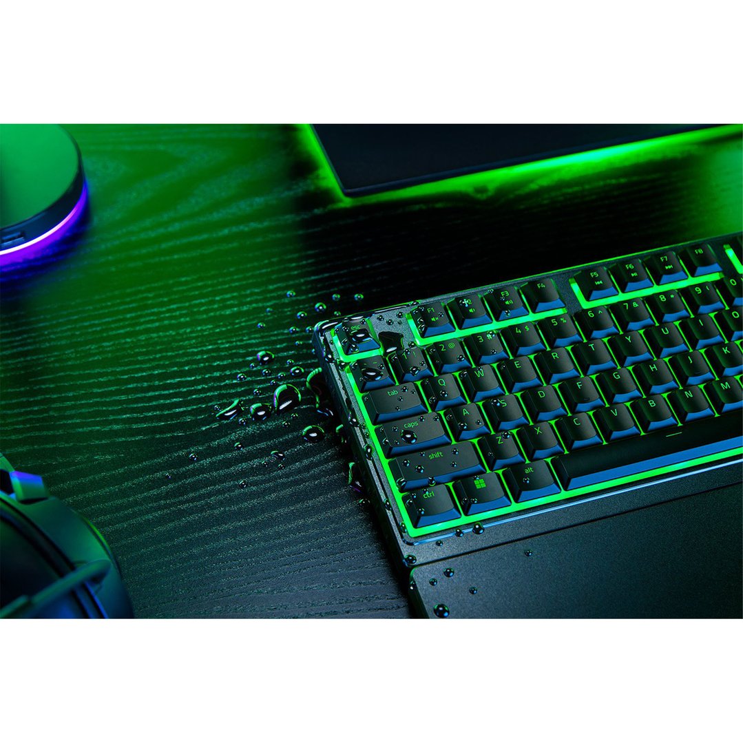 Razer Ornata V3 X Gaming Keyboard with green backlighting and water droplets