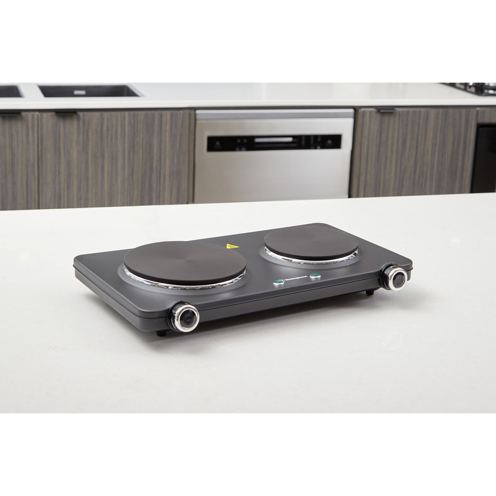 Double electric hotplate on a white countertop in a modern kitchen