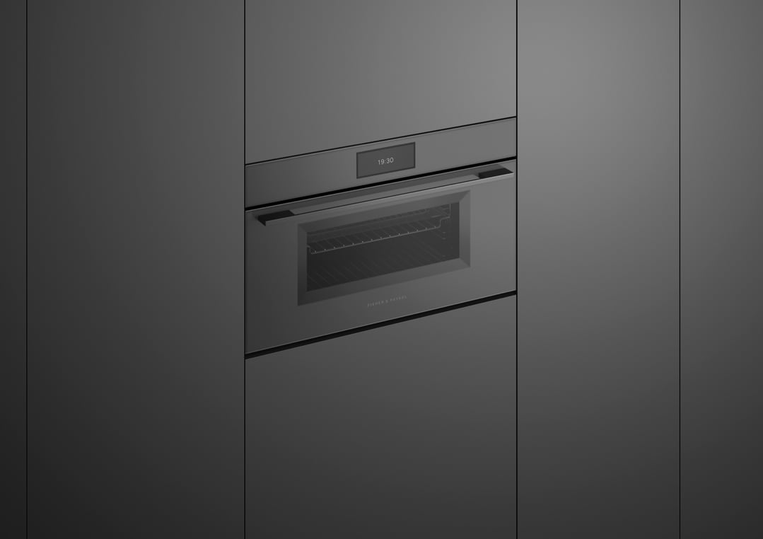 Built-in compact combi-steam oven with a digital display showing 19:30