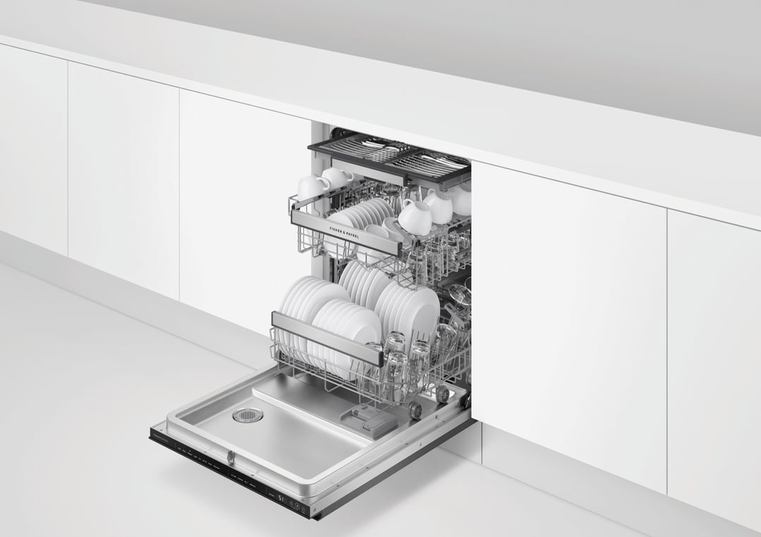 Dishwasher with door open, full of clean dishes in a white kitchen