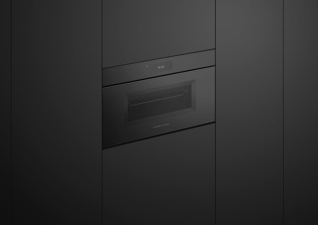 Built-in compact combi-microwave oven with a digital display showing 19:30