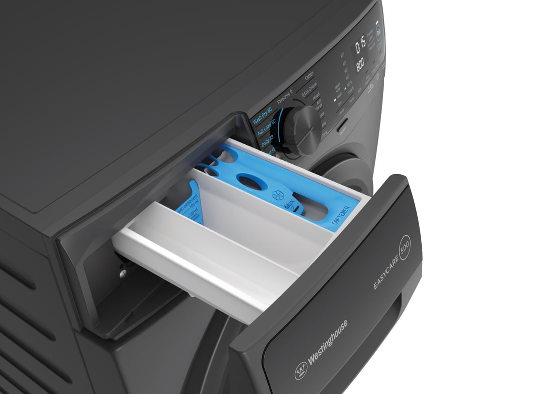 Close up of a washing machine with the detergent drawer open