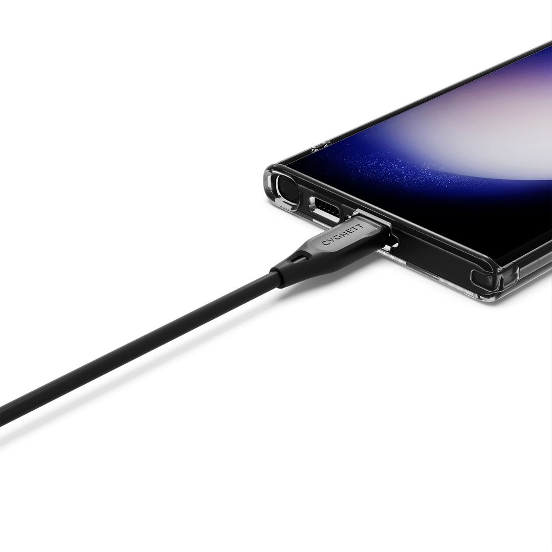 Black USB-C to USB-C cable plugged into a smartphone on a white background