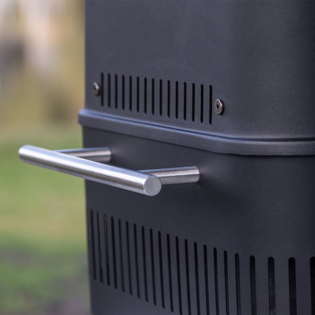 Close up of the black portable charcoal BBQ with a silver handle