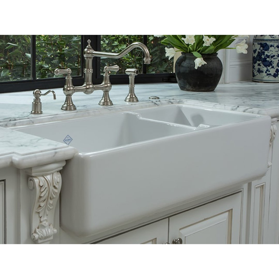 White double bowl sink with a faucet in a kitchen setting