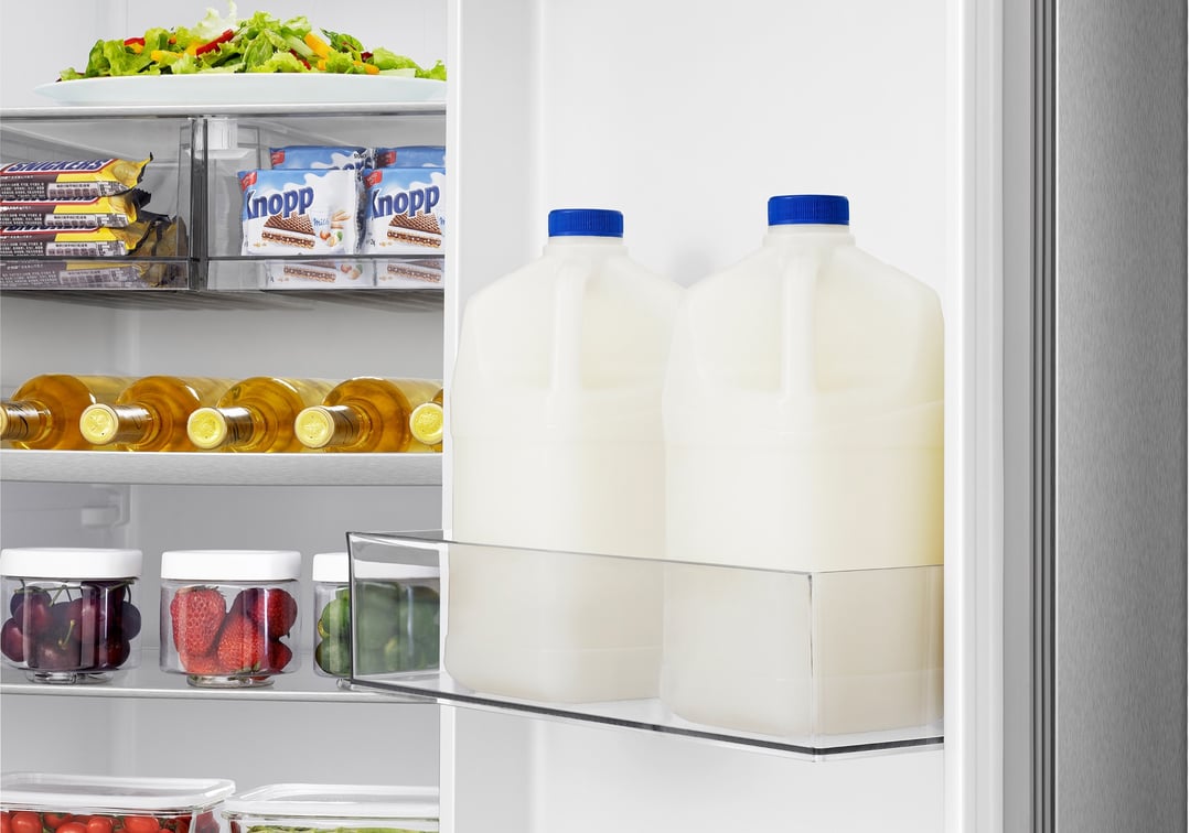 Open Hisense PureFlat Side by Side Fridge interior filled with food items