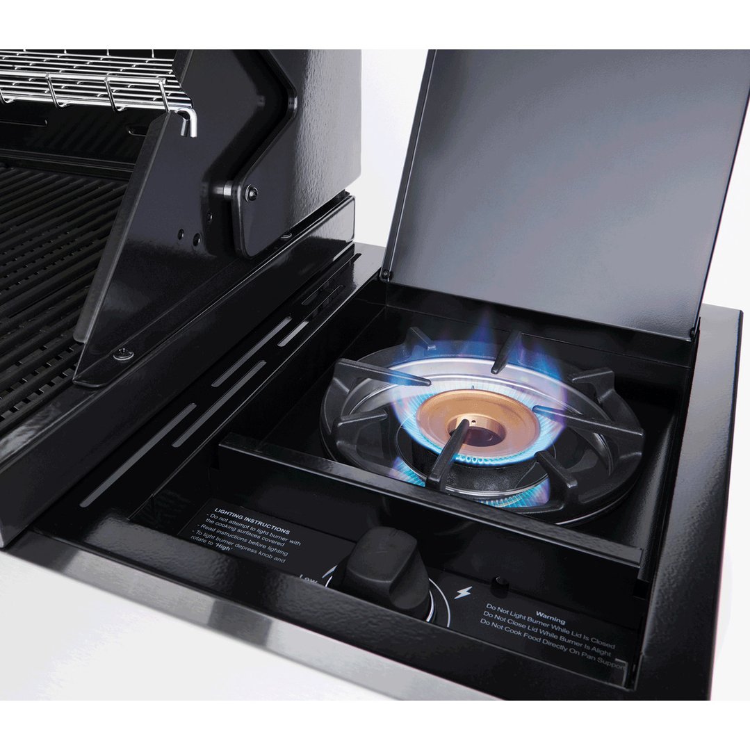 Close-up of a lit side burner on a black barbecue