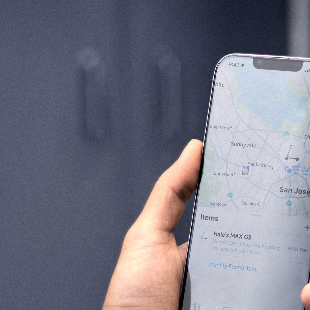 Hand holding a phone displaying a map and a list of items