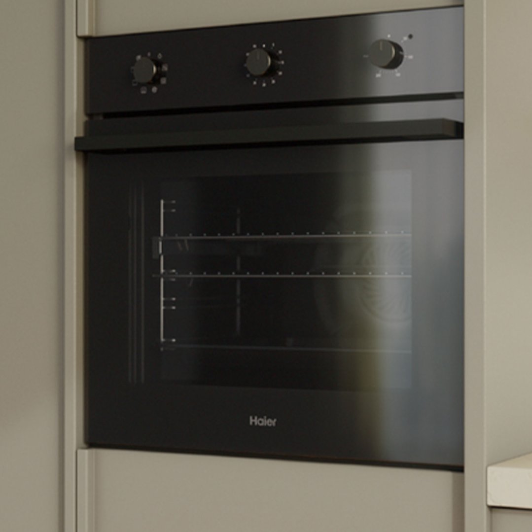 Black built-in oven with three control knobs in a light grey kitchen cabinet