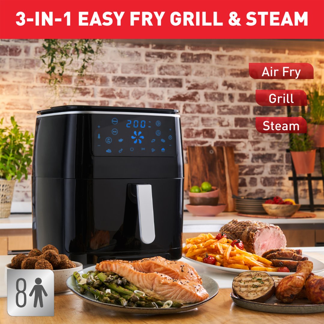 TEFAL Easy Fry Grill & Steam XXL Air Fryer on a counter with cooked food