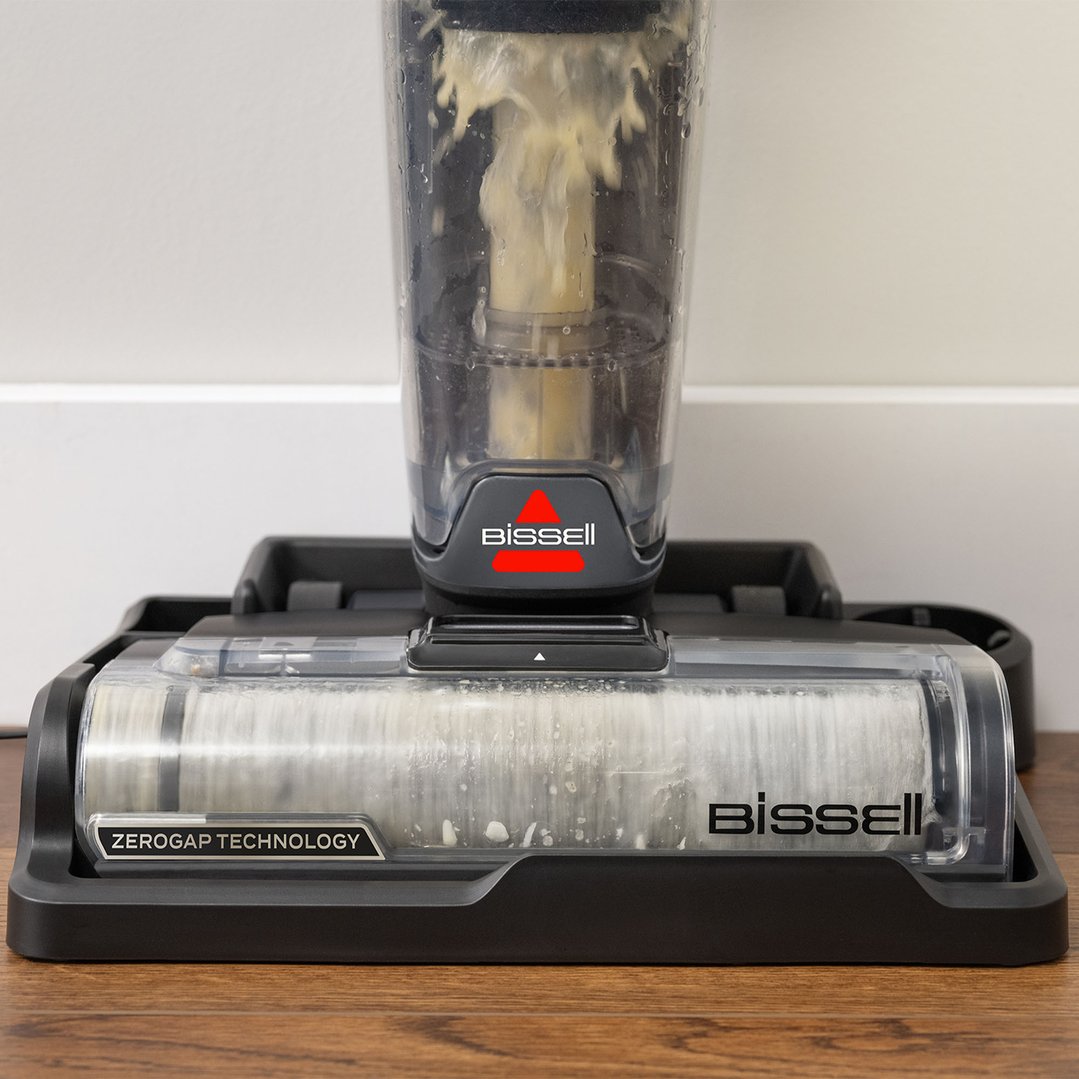 Close up of a BISSELL vacuum cleaner on a wooden floor