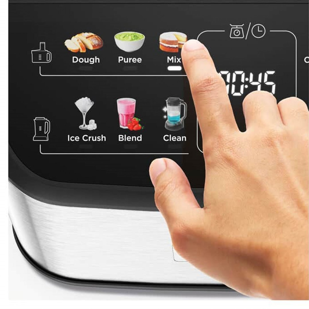 Hand touching the screen of a food processor showing different functions