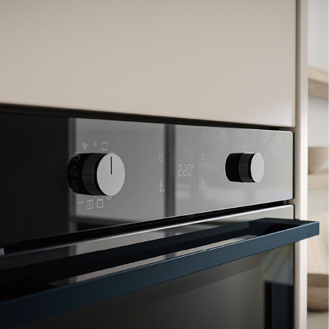 Built-in oven with control knobs and digital display in a kitchen setting