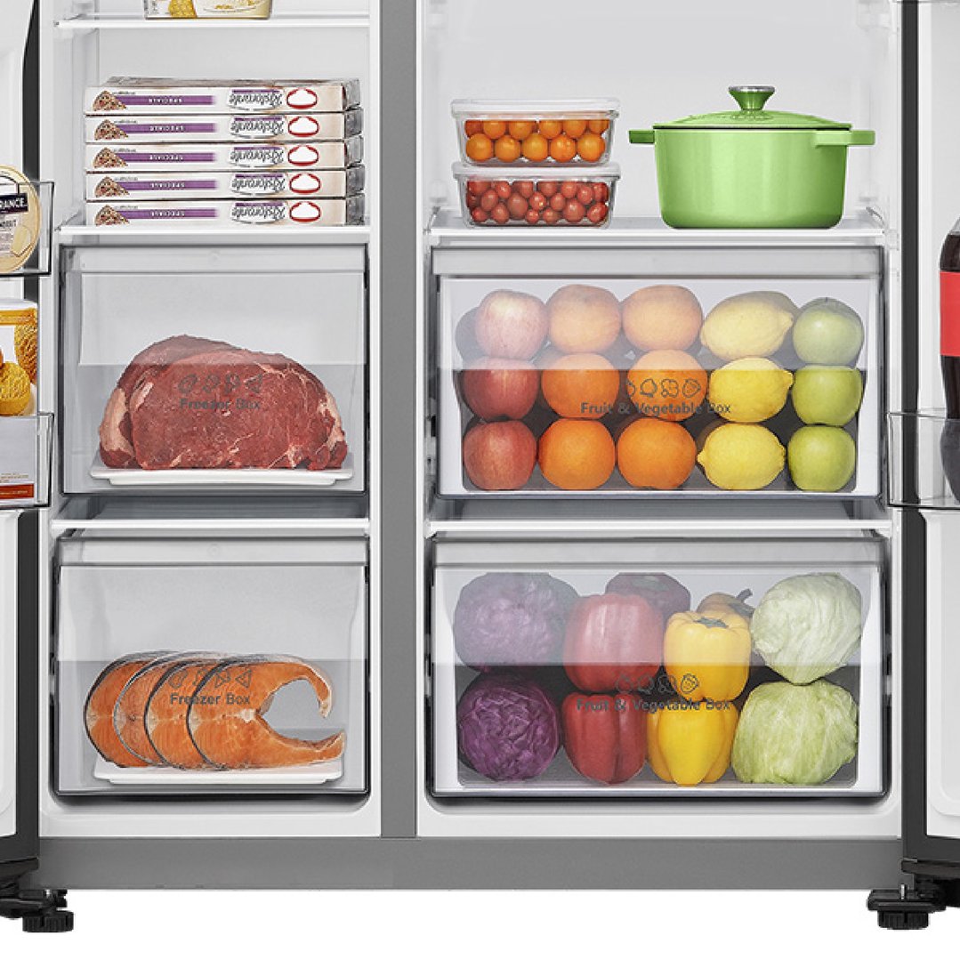 Inside view of a Hisense fridge showing food items on shelves and in drawers