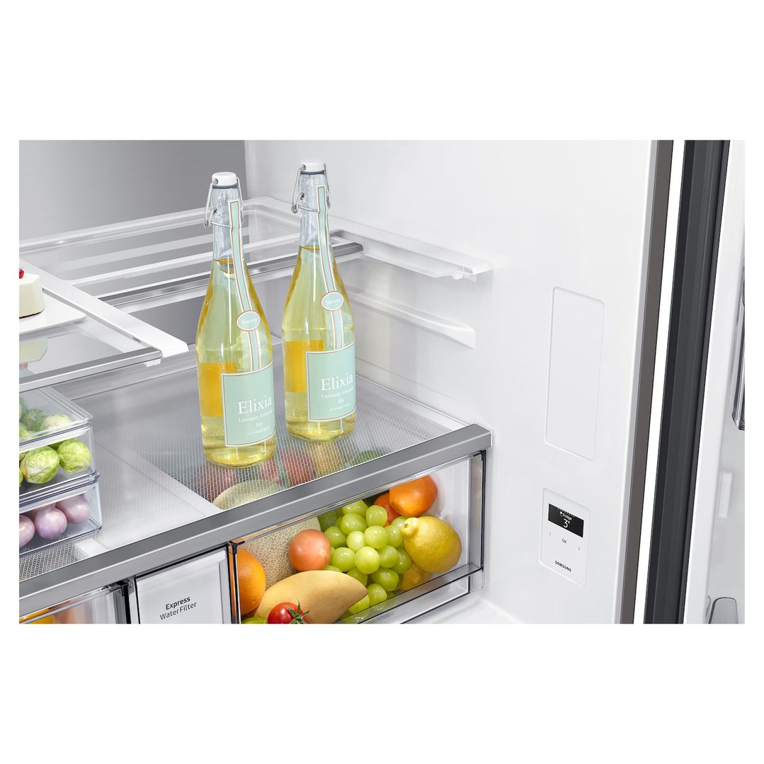 Open refrigerator interior with bottles, fruits, and vegetables on shelves and in drawers