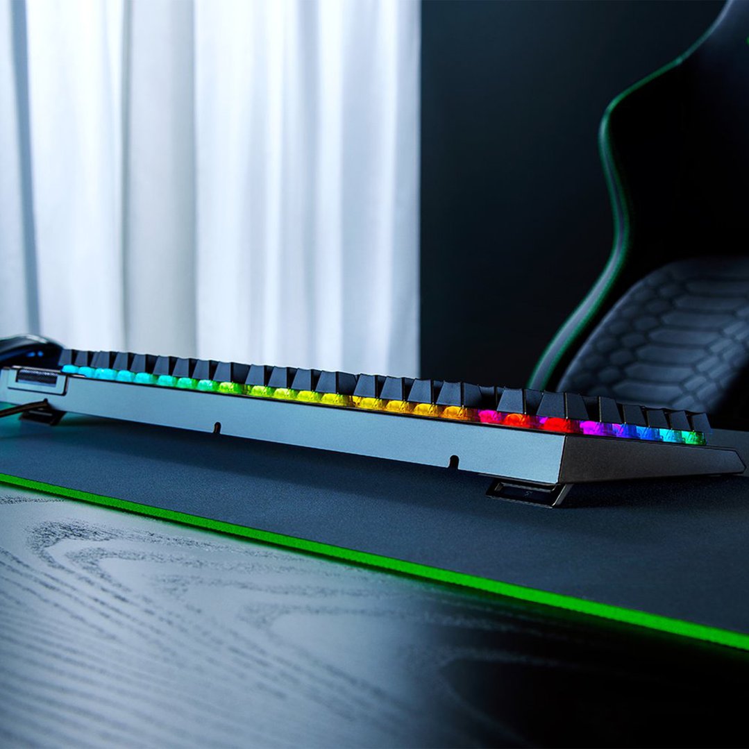 RAZER BlackWidow V4 X keyboard with RGB lighting on a desk with a mousepad