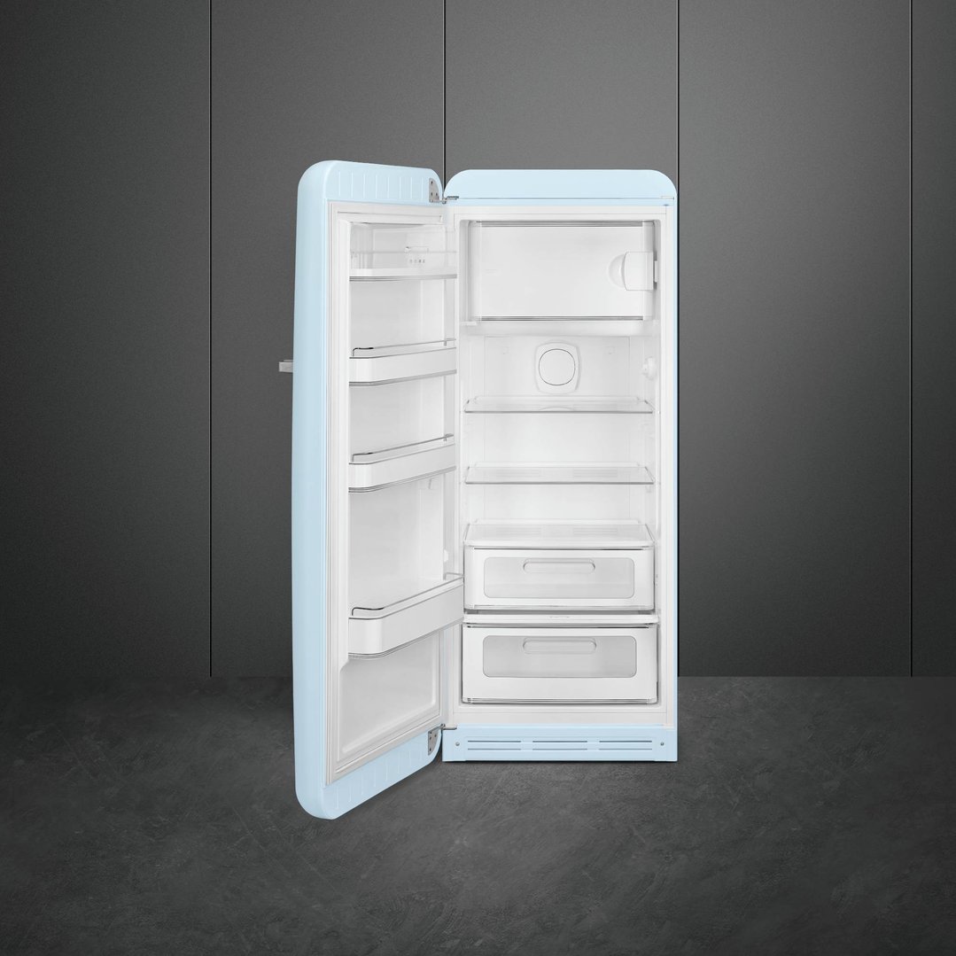 Open pastel blue retro refrigerator in a dark grey room