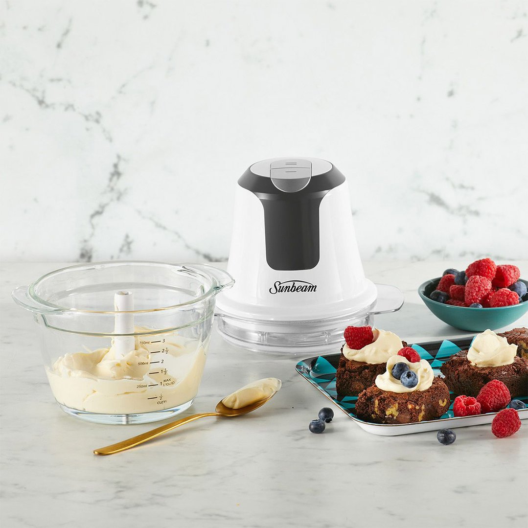 Sunbeam Mini Glass MultiChopper with brownies and berries on a marble surface