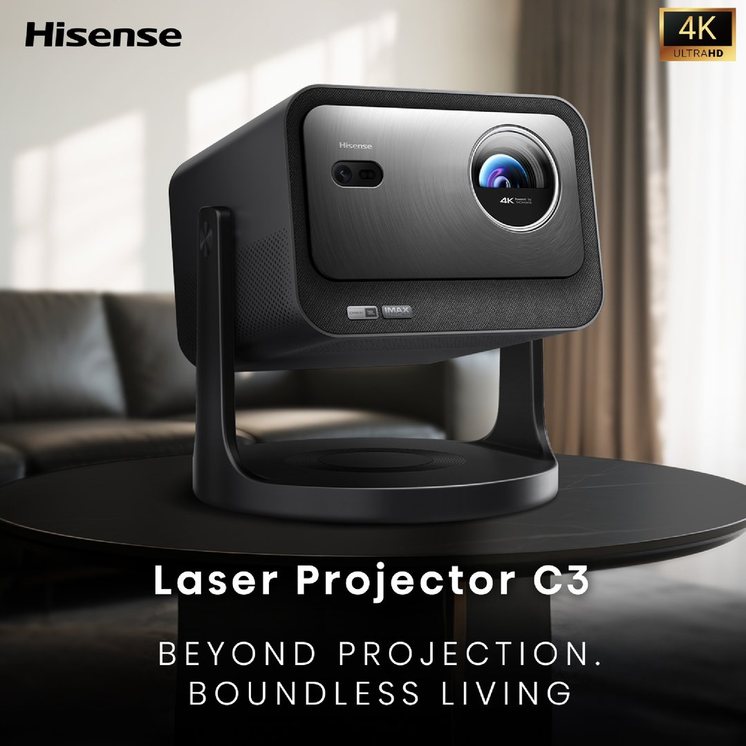 Hisense laser projector C3 on a black table in a living room setting