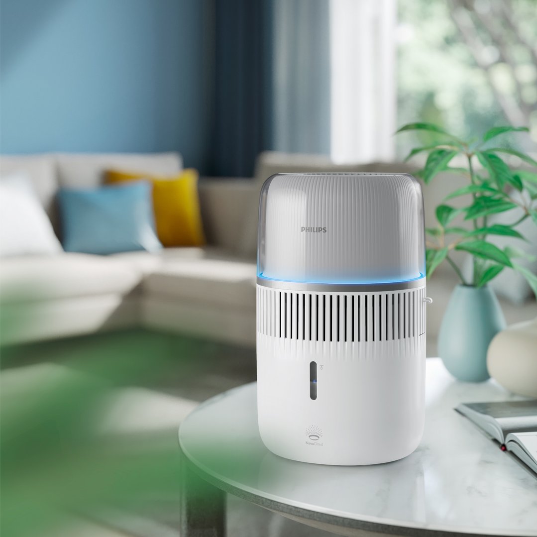 Philips Series 5000 Evaporative Humidifier on a glass table in a living room