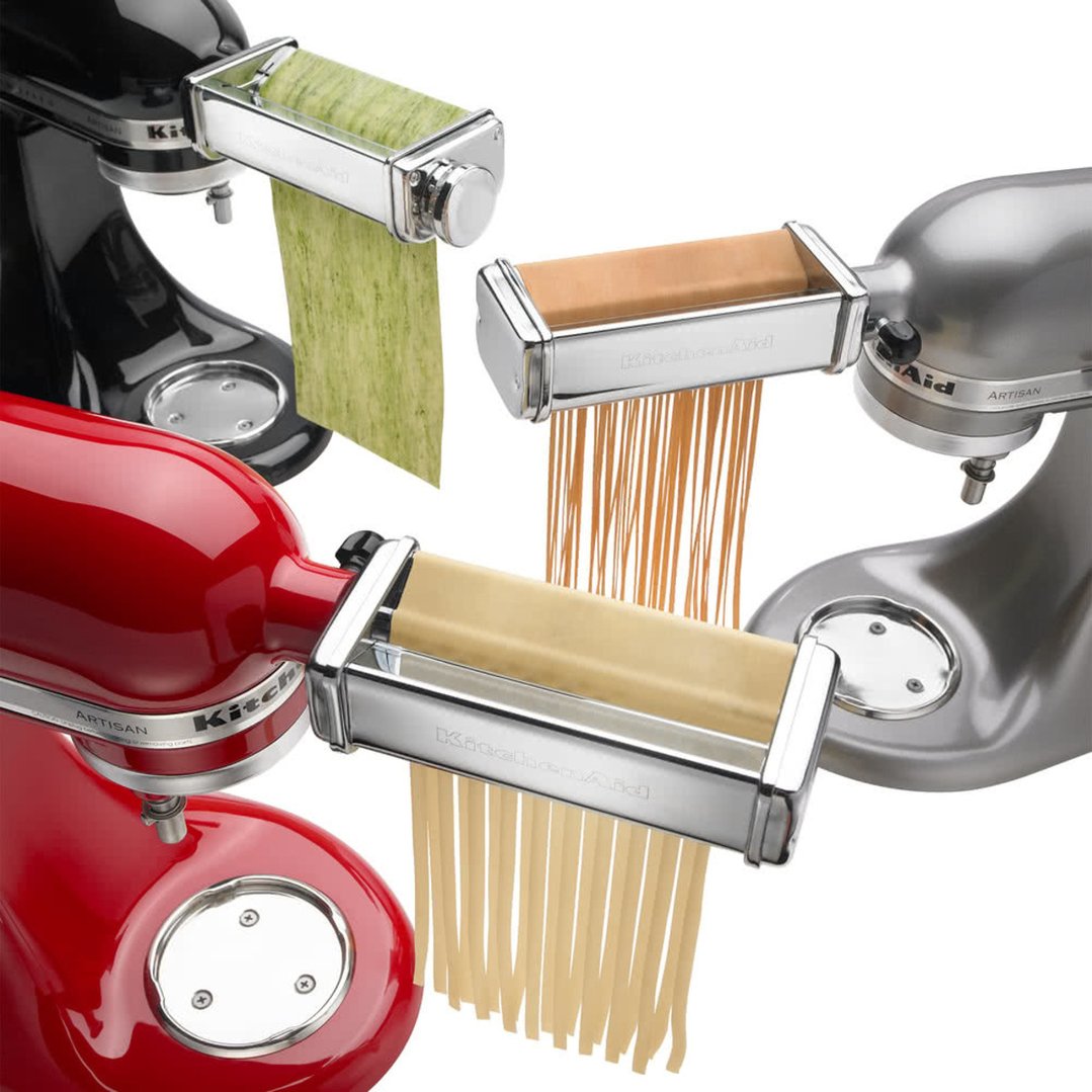 Three KitchenAid pasta rollers attached to stand mixers making different types of pasta