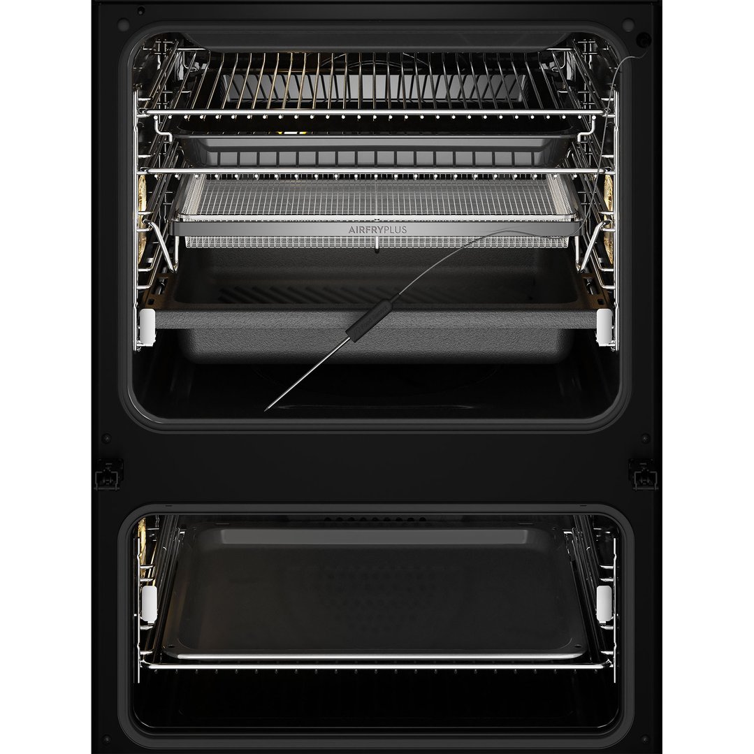 An open dark stainless steel oven with an air fry basket and food sensor
