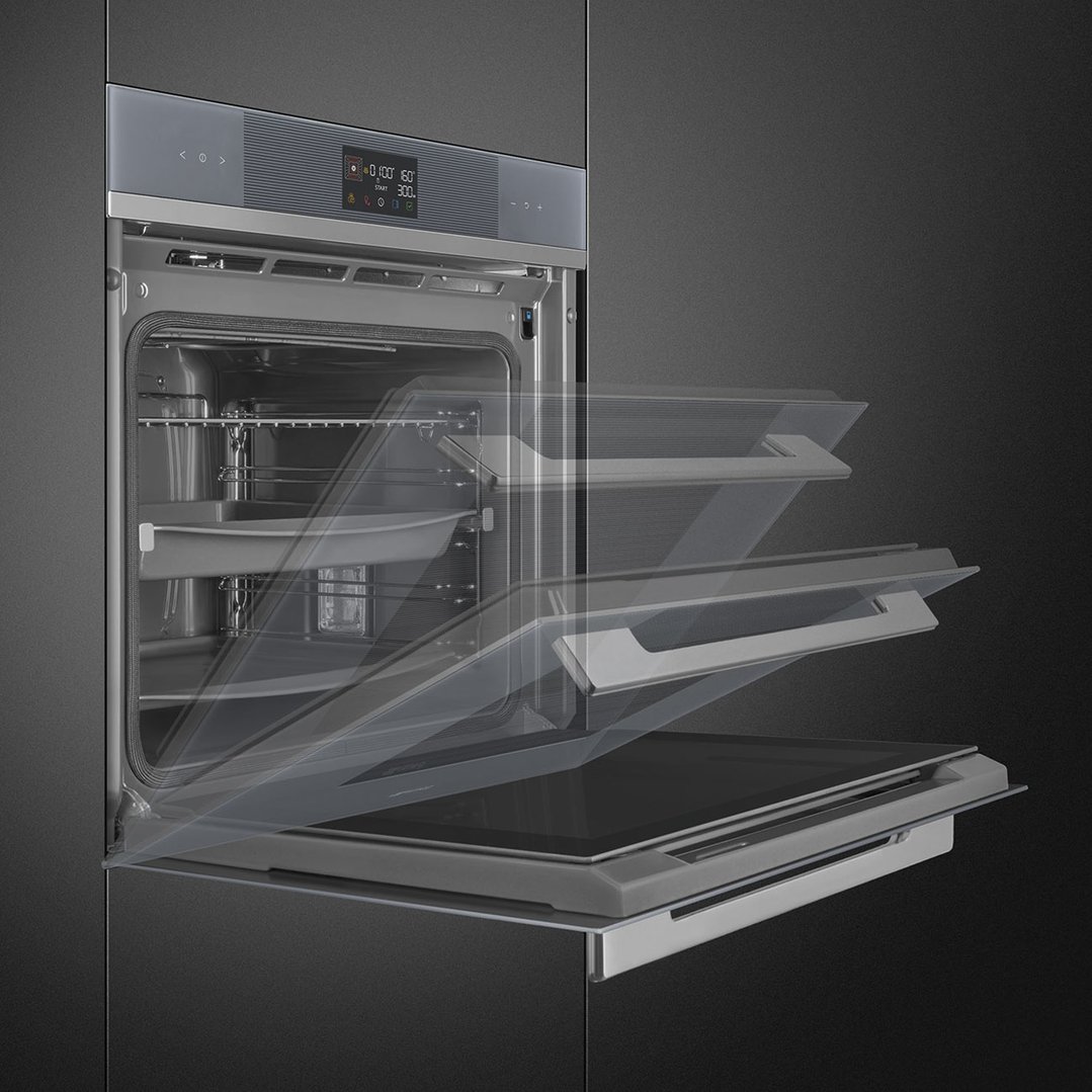 A built-in oven with its door open, showing the interior and racks