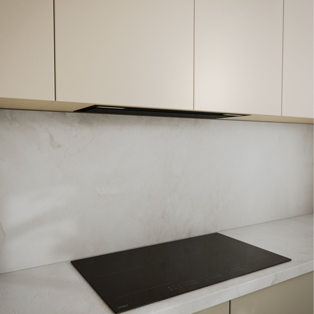 Integrated rangehood installed above a cooktop in a modern kitchen setting