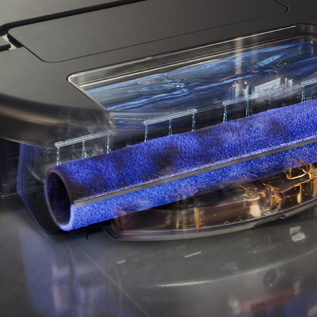 Close up of the vacuum cleaner's blue roller brush and water tank