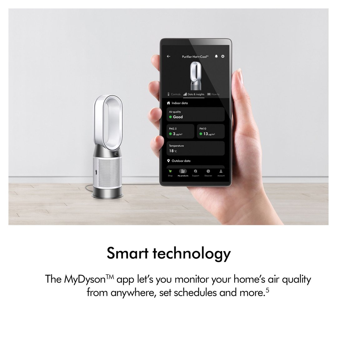 Hand holding a smartphone displaying the MyDyson app next to a Dyson air purifier