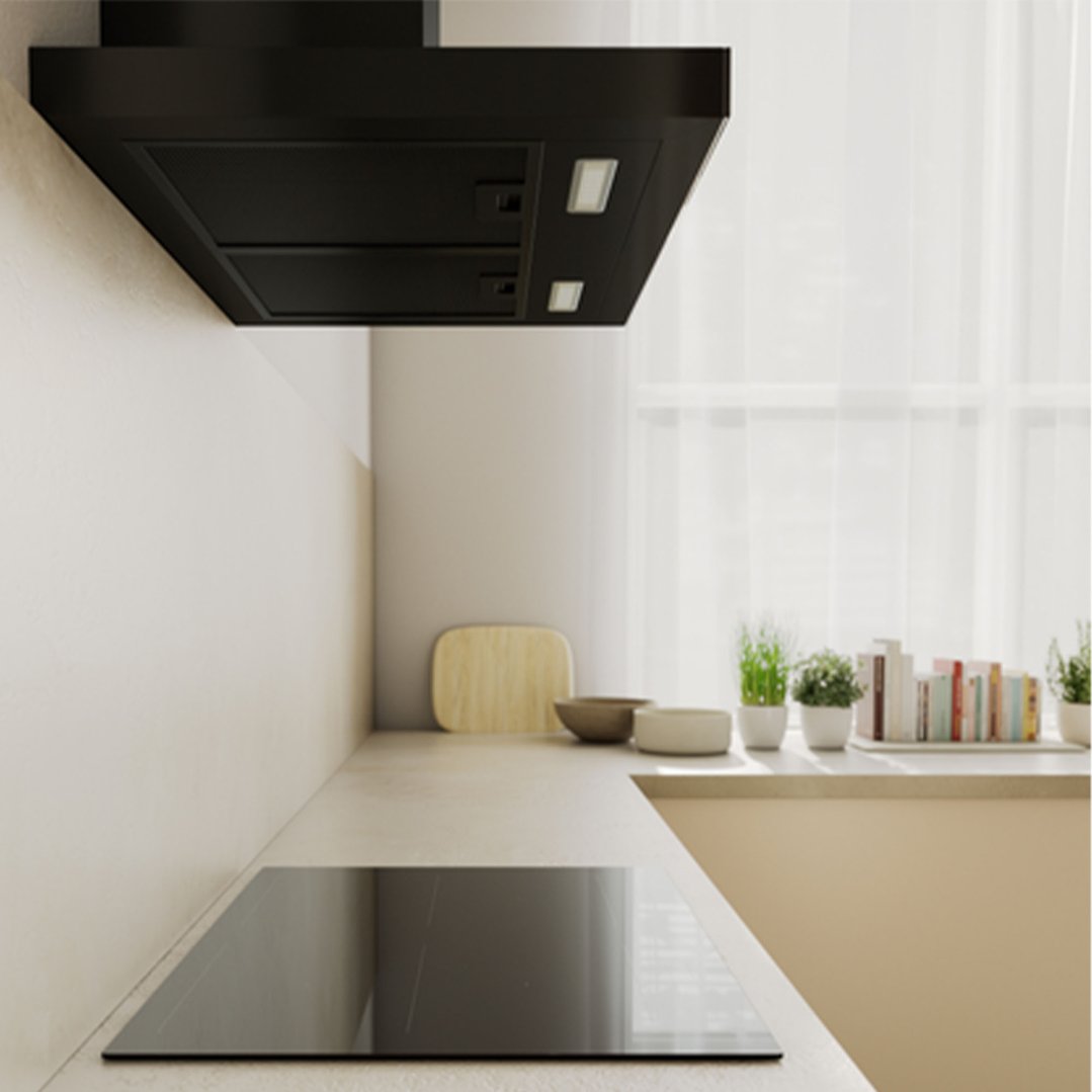 Black rangehood installed above an induction cooktop in a modern kitchen