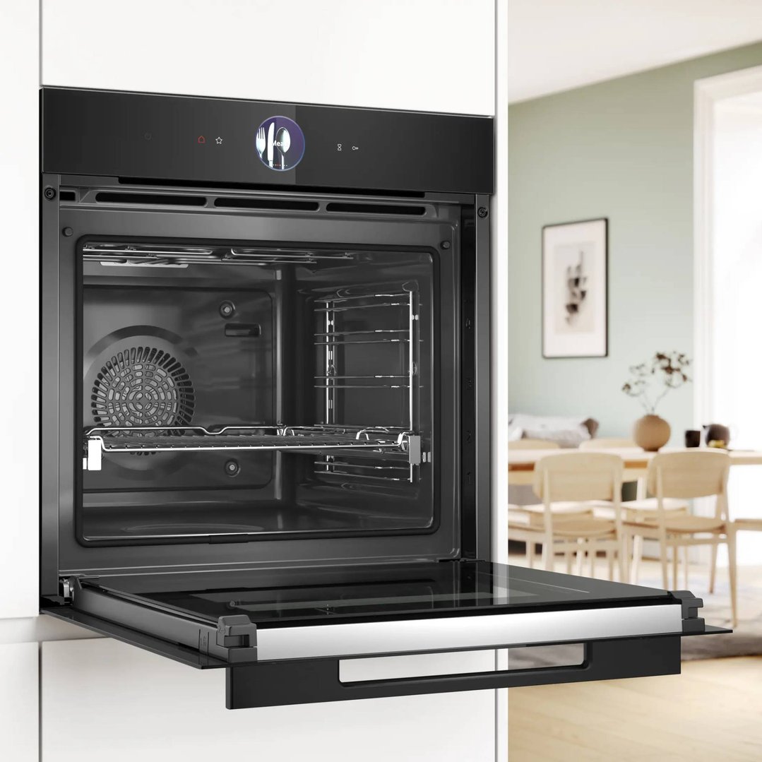 Built-in oven with open door in a modern kitchen setting