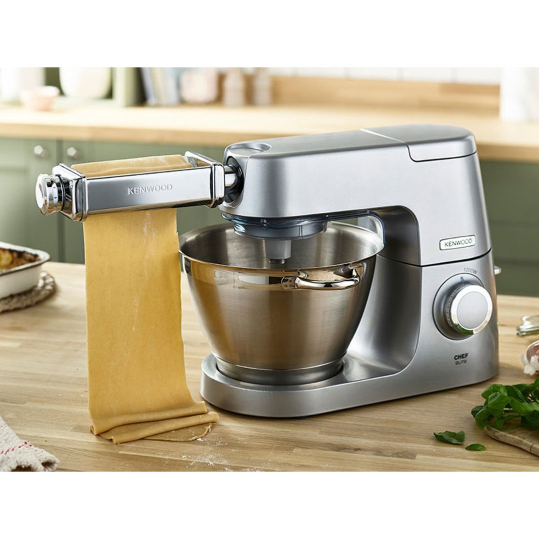 Kenwood Lasagne Roller attached to a stand mixer, making pasta on a wooden counter