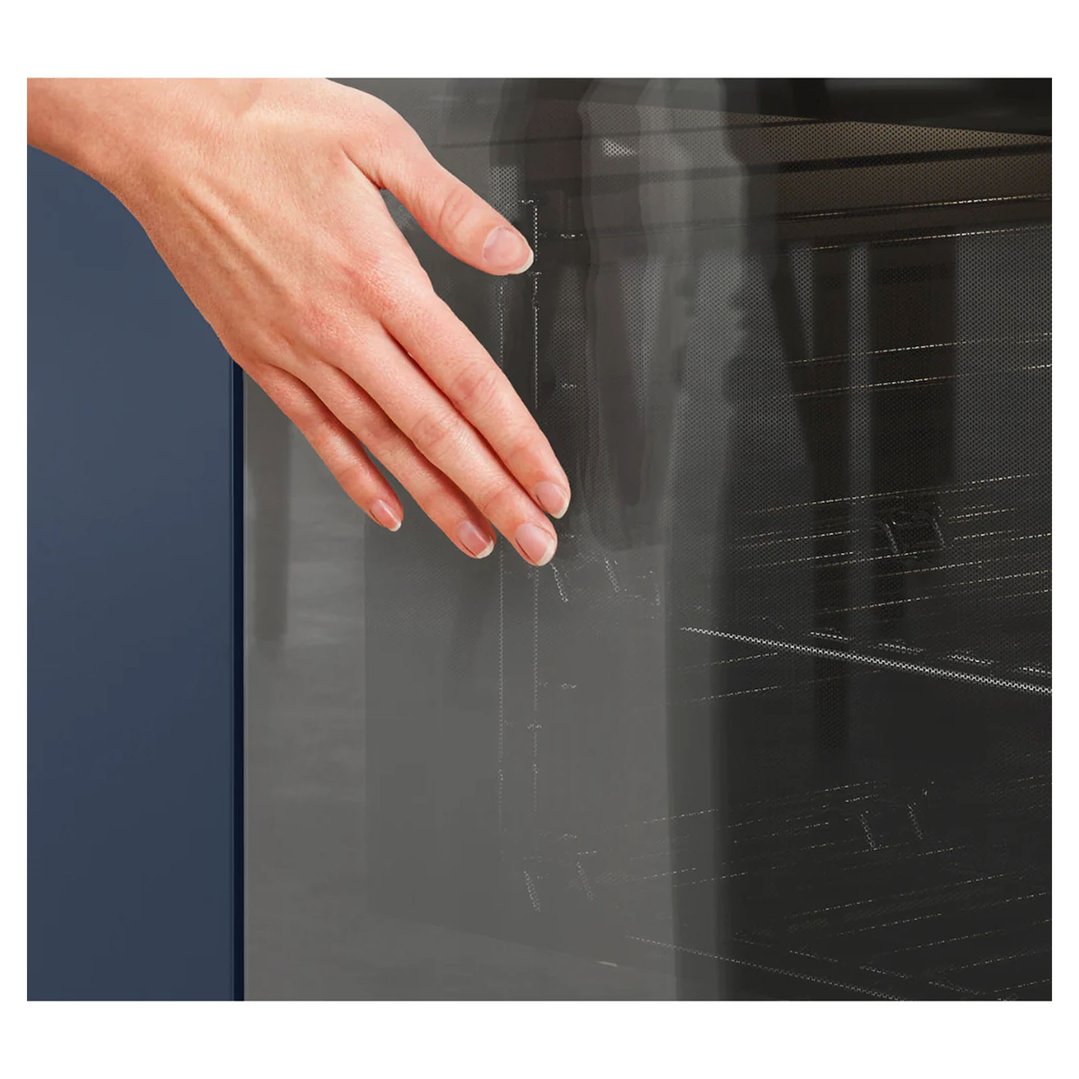 Woman's hand touching the glass door of a built-in oven