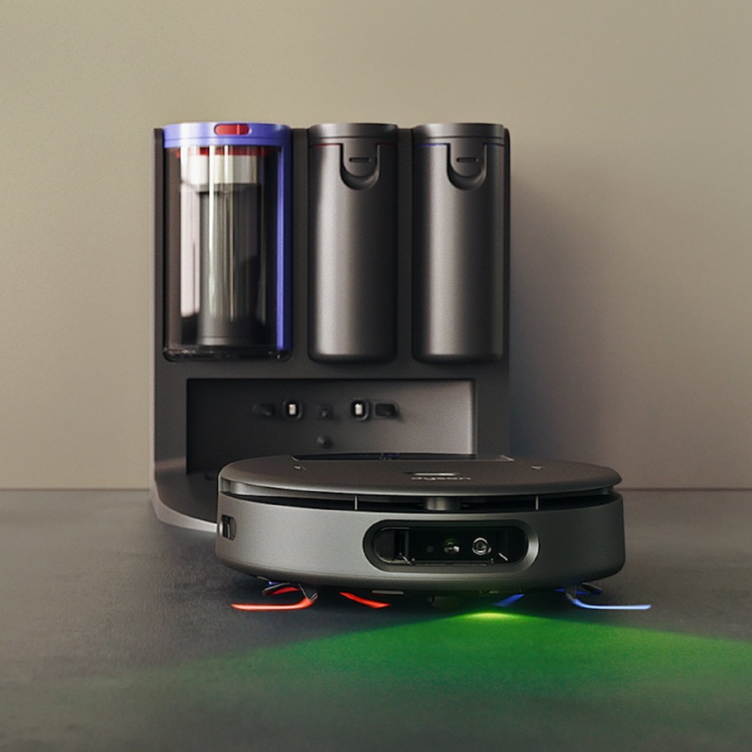 Dyson Spot+Scrub Ai Robot Vacuum Cleaner and charging dock on a dark floor