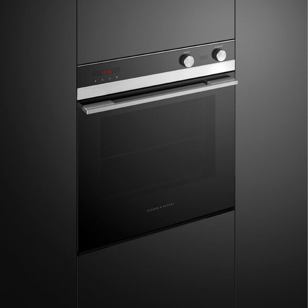 Black built-in oven with a stainless steel handle and control panel
