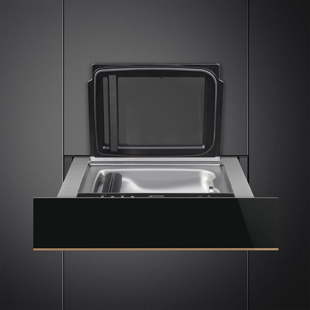 Sous-vide and vacuum drawer with the lid open, built into a dark kitchen cabinet