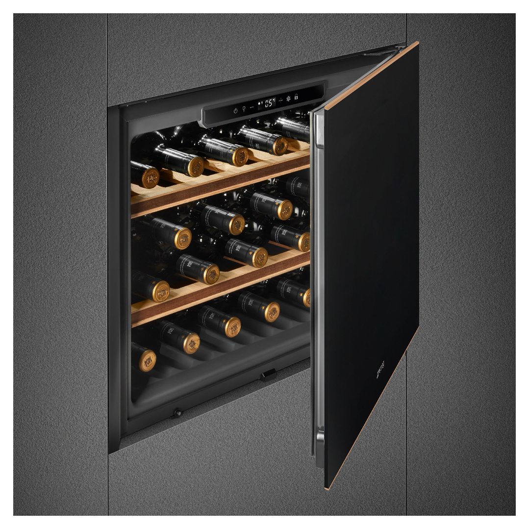 Built-in wine cooler with black door open, showing wine bottles inside