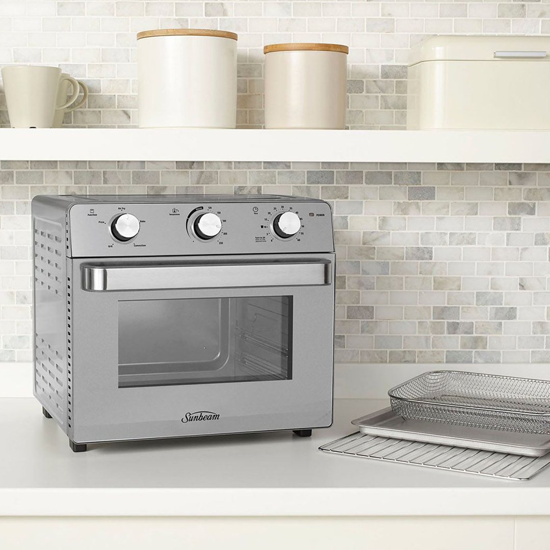 Sunbeam Multi Function Oven + Air Fryer on a kitchen counter with accessories