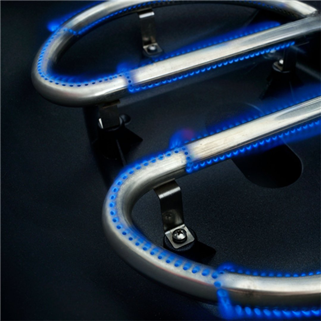 Close up of the blue flames from the burners of a barbeque