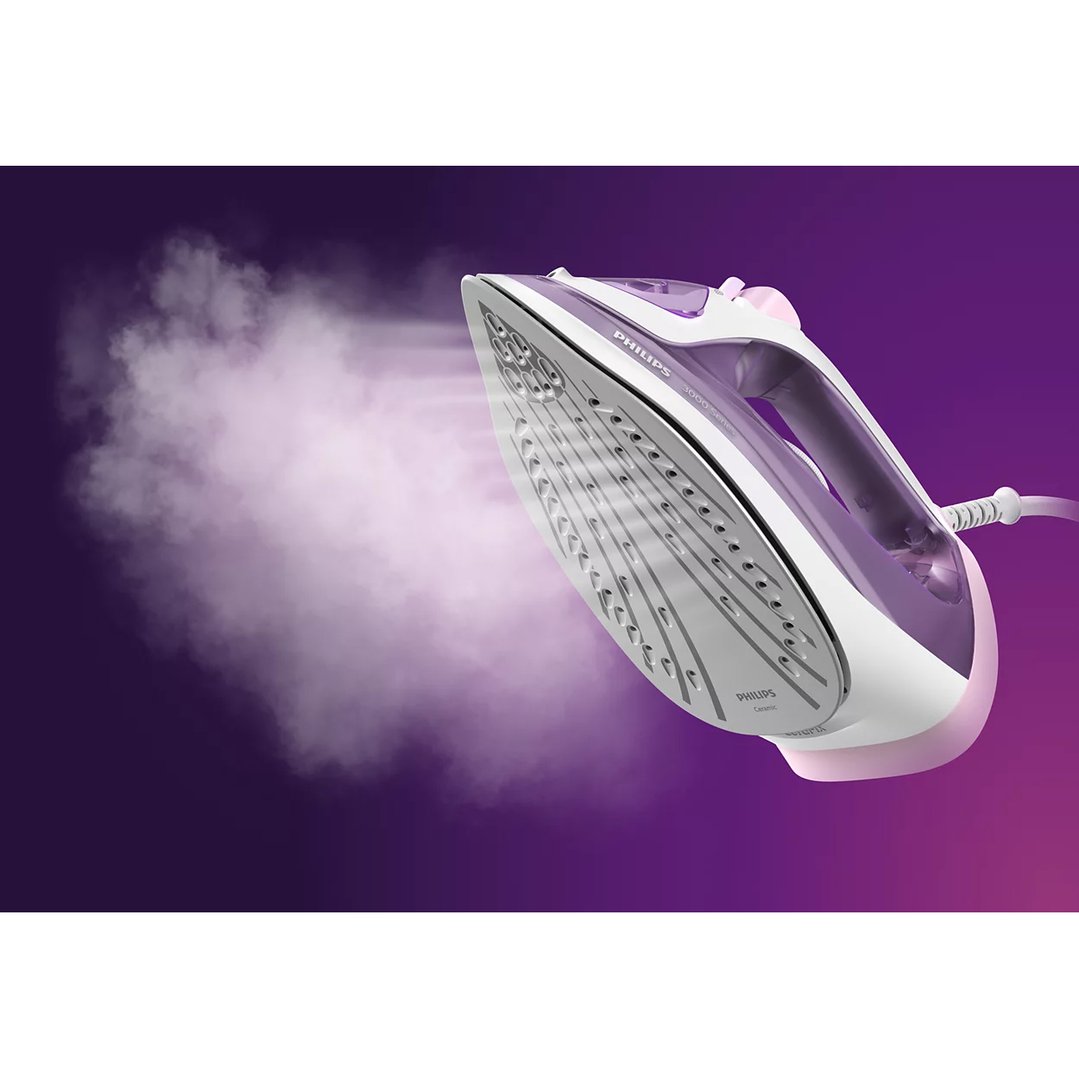 Philips Series 3000 steam iron emitting steam on a purple background