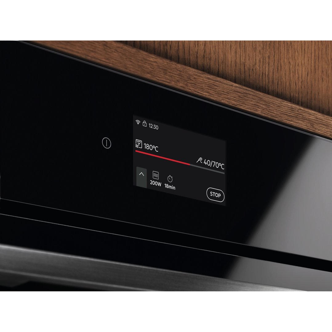 Close up of a microwave oven's digital display showing cooking settings