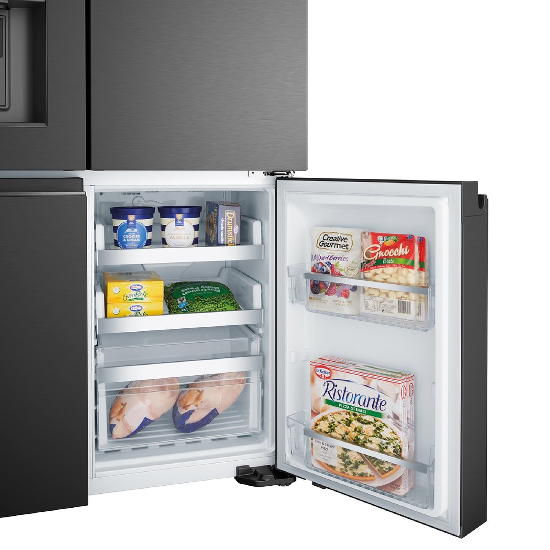 Open freezer compartment of a black quad door fridge filled with frozen food